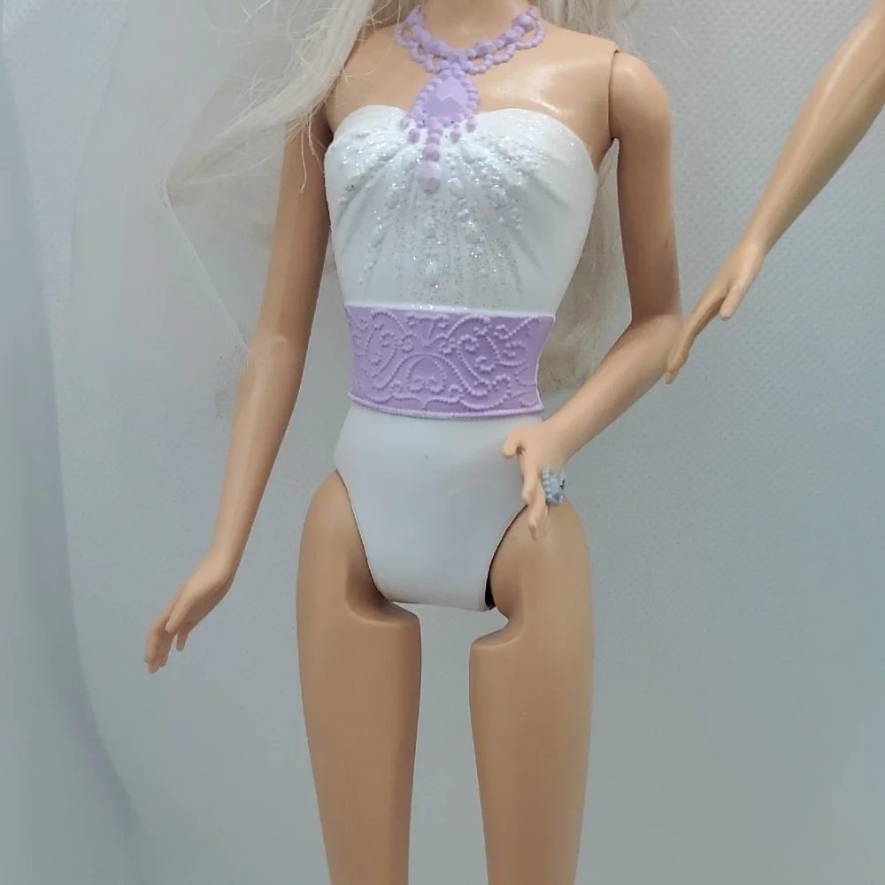 Mattel Dolls with Blonde Hair and Colorful Outfits